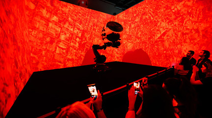 Image of a robotic display lit with red light