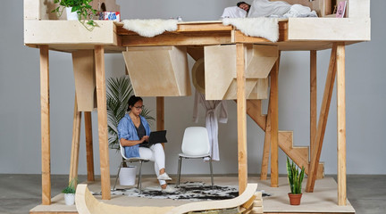 Image of people lounging on an indoor treehouse