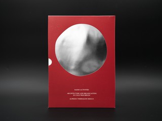 A red book cover on a black and gray background