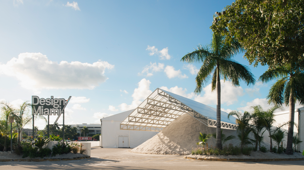 Image of a pile of sand under a white tent covering