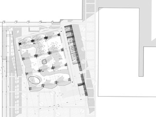 Black and white plan drawing of building and its surrounding context.