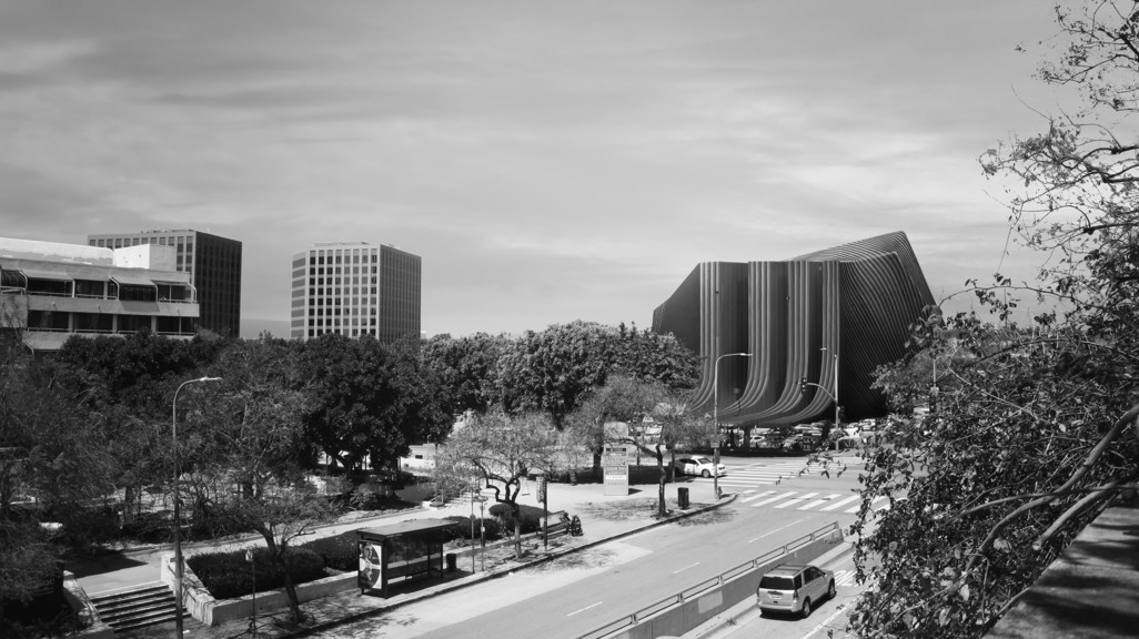 Black and white rendering of project nestled within cityscape.